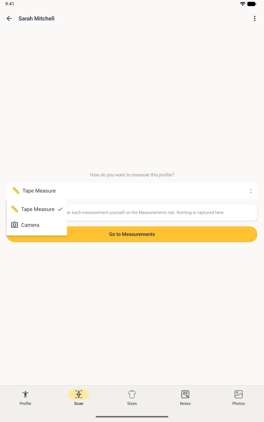A full-screen Scan tab on a tablet with the measuring mode dropdown open at the left under How do you want to measure this profile?, listing Tape Measure with a tick and Camera with a camera icon, over the yellow Go to Measurements button, with the Profile, Scan, Sizes, Notes and Photos bar at the bottom.