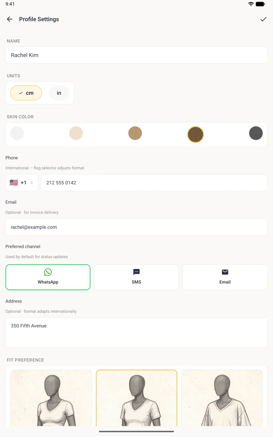 Profile Settings screen with the name Rachel Kim, cm selected, a brown skin tone ringed in gold, the phone 212 555 0142, the email address, WhatsApp outlined as the preferred channel, the address 350 Fifth Avenue and the top of the fit preference sketches with Regular outlined in gold.