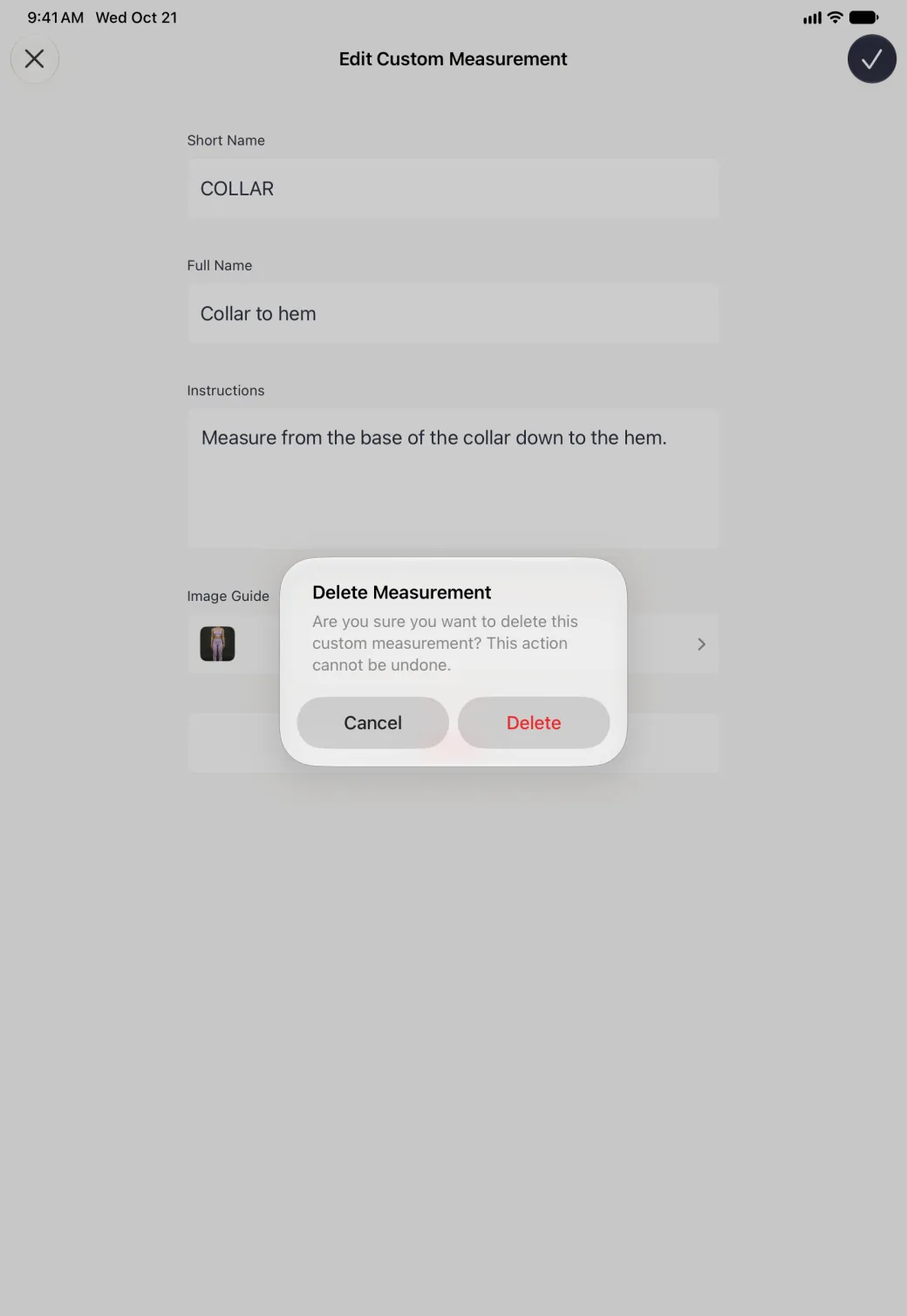 A Delete Measurement alert centred over the dimmed Edit Custom Measurement page on the iPad, reading Are you sure you want to delete this custom measurement? This action cannot be undone., with Cancel and a red Delete button side by side.