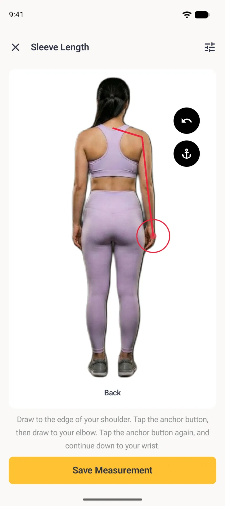 A back view scan photo with a red line running from the base of the neck out to the right shoulder, then down the outside of the arm past the elbow to the wrist, where a red target circle sits, with round undo and anchor buttons at the upper right.