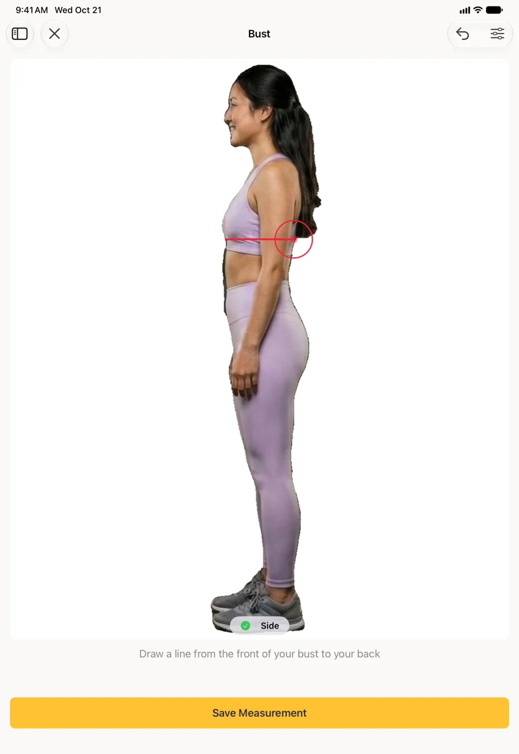 A large side profile scan photo on the iPad with a short horizontal red line drawn from the front of the bust through to the back, the red target circle at its back end, a pill at the foot of the photo with a green tick beside Side, the instruction Draw a line from the front of your bust to your back, and a wide yellow Save Measurement button.