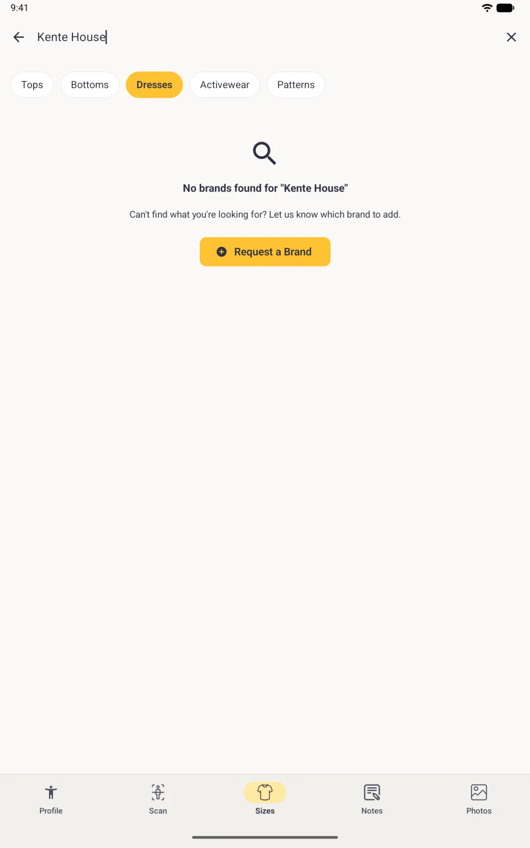 A full-screen no results page on a tablet under the search bar reading Kente House, with a magnifying glass icon, the line No brands found for Kente House, an invitation to say which brand to add and a yellow Request a Brand button.