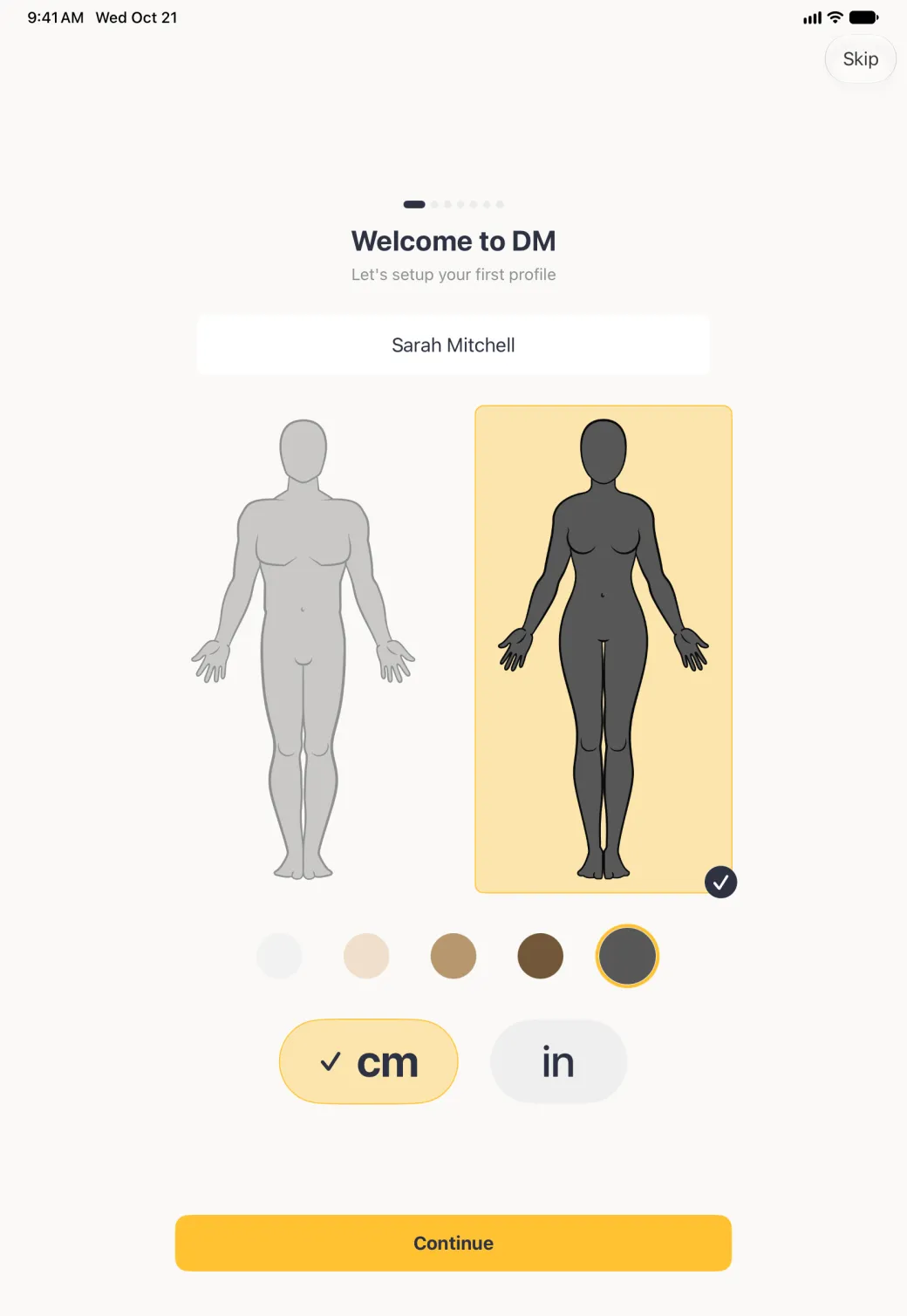 Welcome to DM screen in portrait with the name Sarah Mitchell, the large woman outline in the darkest (charcoal) skin tone inside a gold panel with a navy tick, the man outline turned pale grey, the charcoal tone circle ringed in gold, cm ticked in a gold pill beside in, and a wide gold Continue button at the foot of the screen.