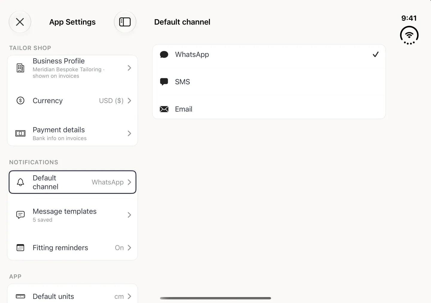 App Settings filling the open Duo in landscape as a split view: the settings list on the left with Default channel, WhatsApp, outlined under NOTIFICATIONS, and on the right the Default channel page listing WhatsApp, SMS and Email in one card, each with a small dark icon, and a tick beside WhatsApp.