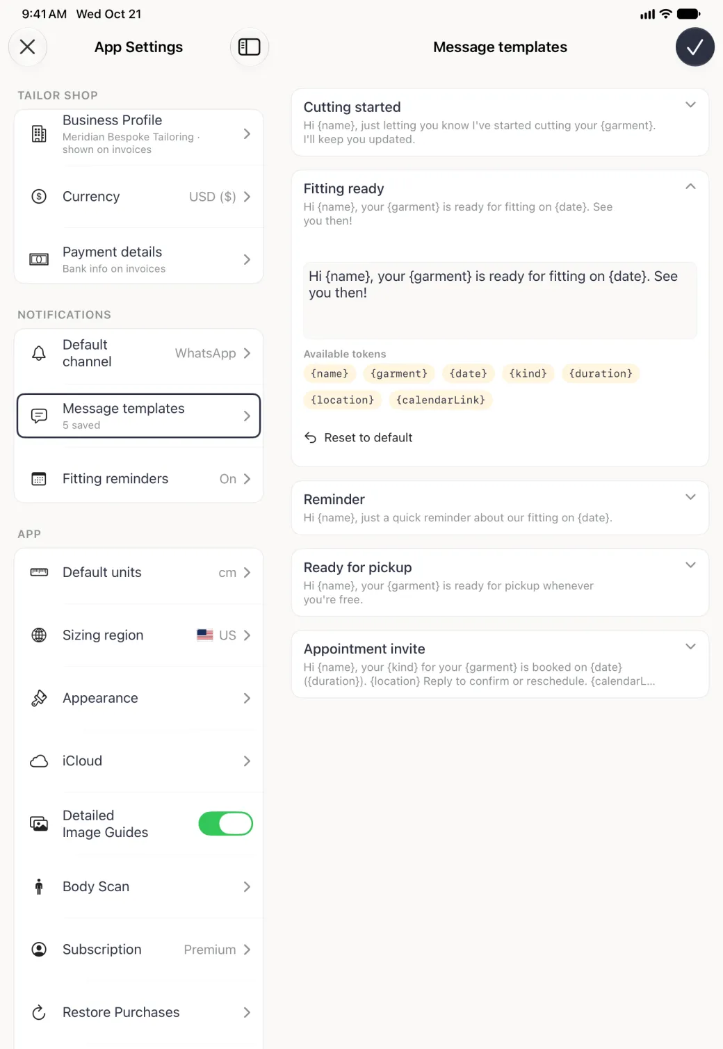 App Settings split view with the Message templates page on the right and the Fitting ready card expanded: an editable text box reading Hi {name}, your {garment} is ready for fitting on {date}. See you then., seven pale gold token chips under Available tokens labelled {name}, {garment}, {date}, {kind}, {duration}, {location} and {calendarLink} wrapping over two rows, and a Reset to default link with a back-arrow icon, above the collapsed Reminder, Ready for pickup and Appointment invite cards.
