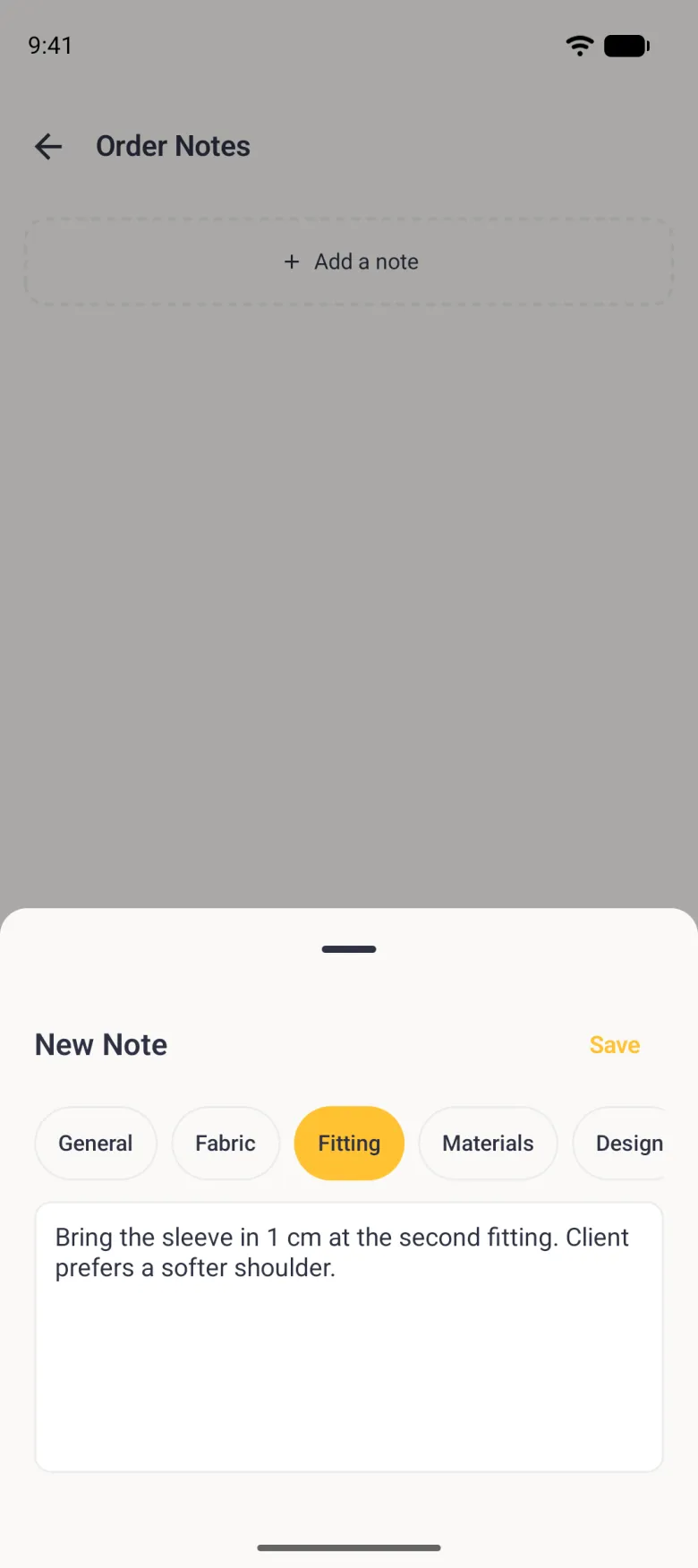 New Note sheet over the dimmed Order Notes screen, with the Fitting tag selected in gold and a note reading Bring the sleeve in 1 cm at the second fitting. Client prefers a softer shoulder, and a gold Save at the top right.