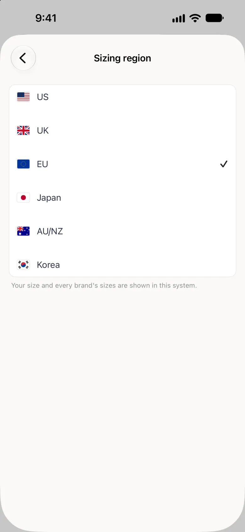 Sizing region page with a back button at the top left and a white card with six rows, US, UK, EU, Japan, AU/NZ and Korea, each with its flag, EU ticked, above the note Your size and every brand's sizes are shown in this system.