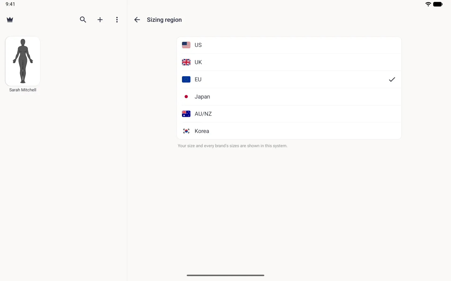 Sizing region in the right-hand pane beside the profile grid: a white card listing US, UK, EU, Japan, AU/NZ and Korea, each with its flag, EU with a navy tick on the right, above the note Your size and every brand's sizes are shown in this system.
